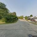 Person unconscious in gold car near playground in Zion
