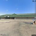 Man with mental issues hitting head on glass at store