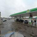 Two men fighting near gas station on Gratiot