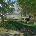 Tractor and baler on fire next to house on Route 39
