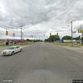 Older woman with walker appears confused near intersection