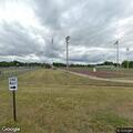 Boy with leg pain at university high football field
