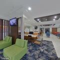 Man having difficulty breathing at hotel lobby