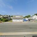 Suspicious vehicle parked behind farm store