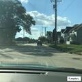 Person experiencing abdominal pain near Liberty Avenue