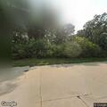 Man acting erratically and throwing backpack on street