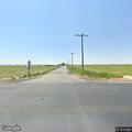 Downed stop sign at rural intersection