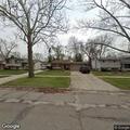 Person experiencing abdominal pain near Elmwood Avenue
