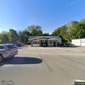Minor two-car crash in auto shop parking lot