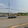 Person waving hammer in Norwich parking lot