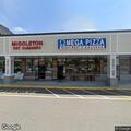 Officer checks open door at dry cleaners