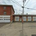 Disabled vehicle in front of fire hall