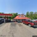 Green van off road near gas station on Route 417