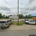 Officer checks open door at bus garage