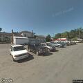 Clothes burning in laundromat parking lot