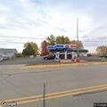 Couple arguing leaves SUV at gas station pumps