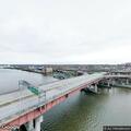Report of pedestrians walking in traffic on bridge