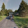 Oil spill in driveway running toward sewer