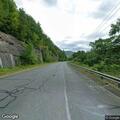 Loose brown and white dog reported on Zoar Road