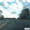 Stalled car moved to turning lane by restaurant