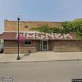 Intoxicated man walking with bike near restaurant