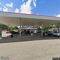Person slumped over steering wheel in car at Speedway