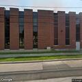 Man running around county office building
