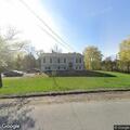 Person pounding on front door at Weatherwax Road home