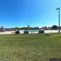 Man yelling and hitting signs at Rockport Pool