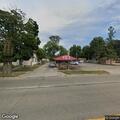 Stalled vehicle with missing tire on Court Street