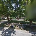 Person walked dog through fenced backyard