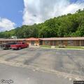 Woman with knee injury and swollen foot at motel