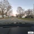 Reckless driver in red pickup nearly hits pedestrian