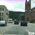 Loose dog running in traffic near theater