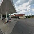 Fire crews establish hose line near Dunkin' Donuts