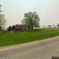 Grass fire spreading near field in Fayette