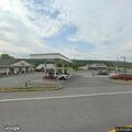 Man unconscious after being pinned between truck and post