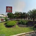 Police stop motorcycle near donut shop