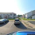 Person experiencing severe back pain in apartment