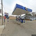 Person possibly unconscious in vehicle at gas station
