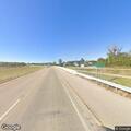 Car with flat tire stopped on Highway 26