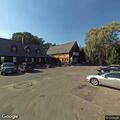 Unresponsive elderly man breathing at Newton bar