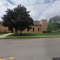 Woman with chest pain and breathing trouble at school