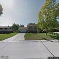 Person knocking on front window at Franklin home