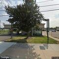 Elderly woman drives over curb at bank parking lot