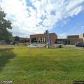Officer checks property damage at local school