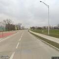 Vehicle driving on rim with tire debris on highway