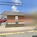Commercial fire alarm reset by maintenance worker