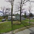 Man with large forearm laceration outside house