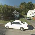 Officer checks red sedan stopped on roadside
